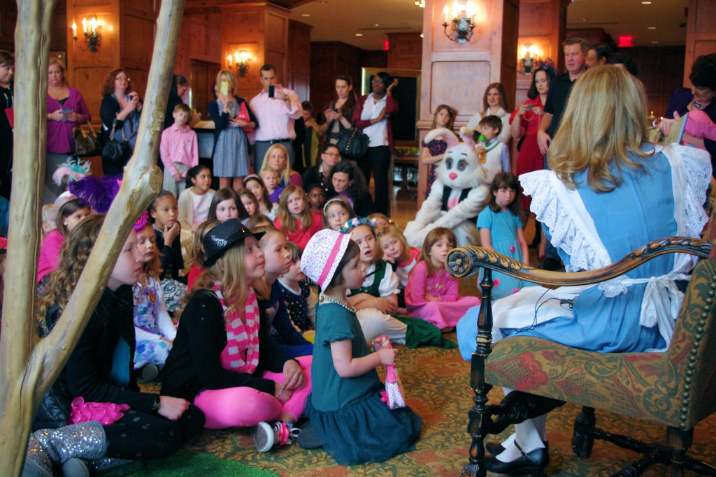 Story Time at Mad Hatter Tea Alice read Alice in Wonderland to Mad Hatter Tea Guests at O.Henry Hotel