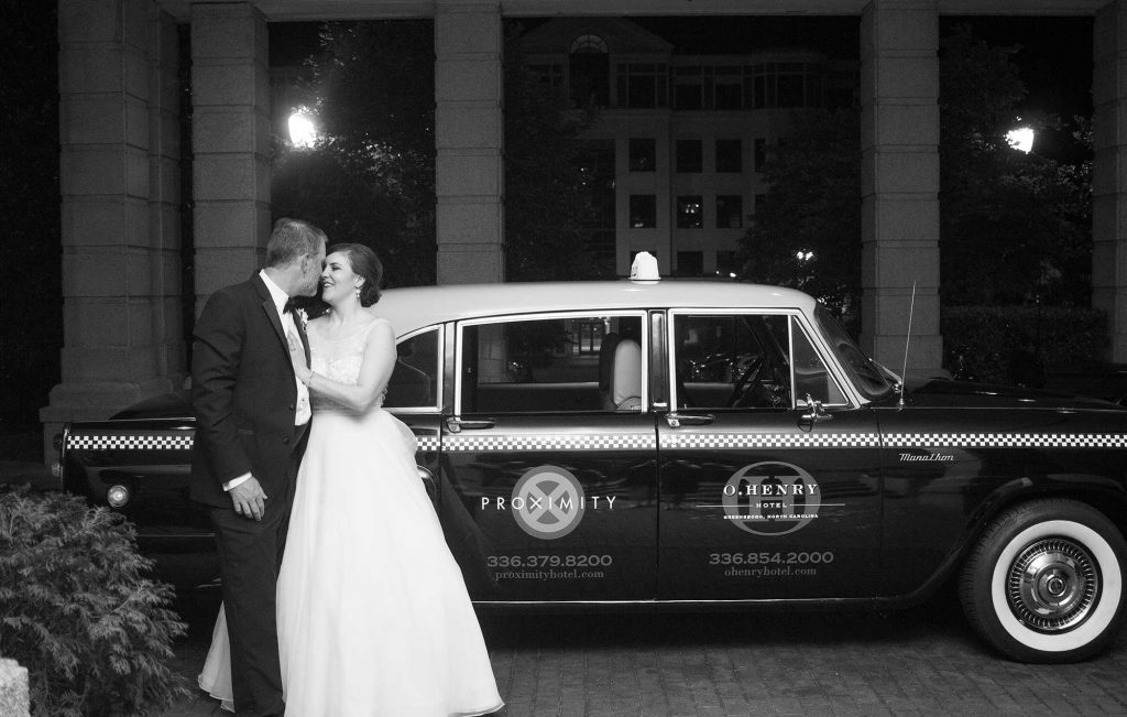 Weddings at O.Henry Hotel with Stephanie and Tim's pose for a London Taxi Departure Weddings at O.Henry Hotel with Stephanie and Tim's pose for a London Taxi Departure