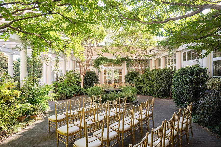 Theater-Style Seating for Garden Wedding | In His Image Photography Theater-style seating for a wedding, facing the arbor in the Cloister Garden at O.Henry Hotel.
