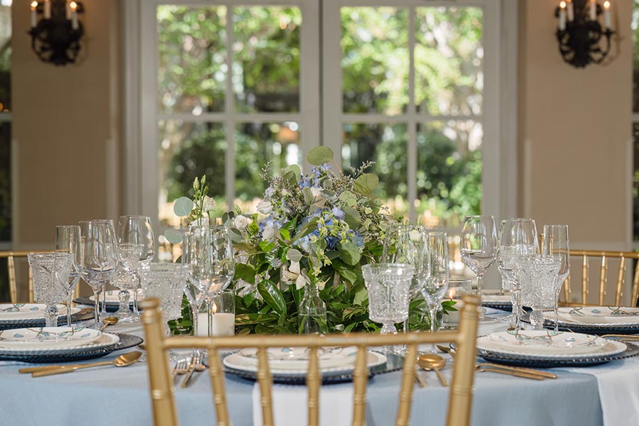 Photo by In His Image Photography Featured in MarryMeNC, a spring wedding styled in dusty blue, in the Pavilion at O.Henry Hotel.