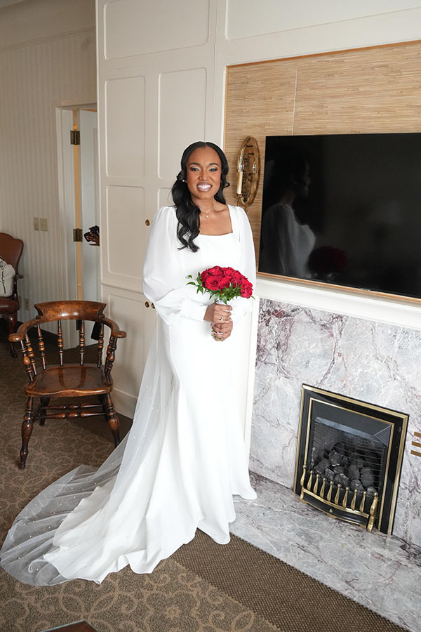 Latisha | Still Shots Photography Latisha puts on her final touches in the Magi Suite.