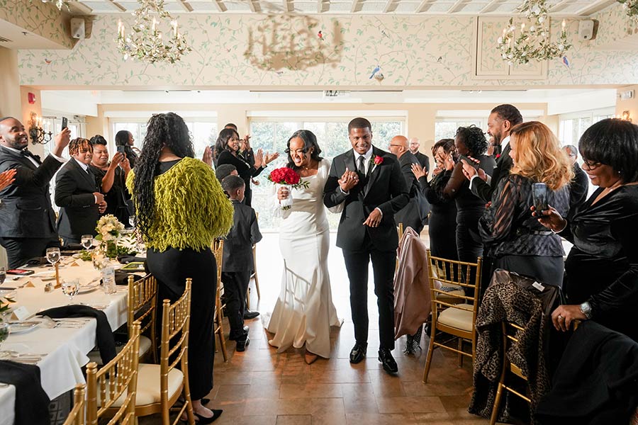 Latisha & Ronald | Still Shots Photography The newly married couple, smile as they are greeted by cheering guests after the ceremony.