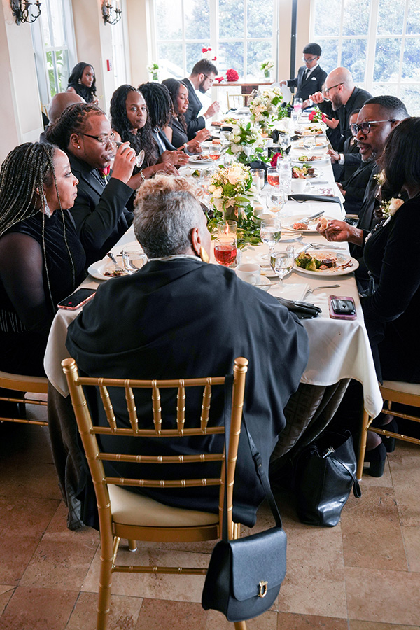 Celebrating | Still Shots Photography Family and friends gathered around the table to celebrate Latisha and Ronald, sharing conversation, laughter, and the joy of a new beginning.