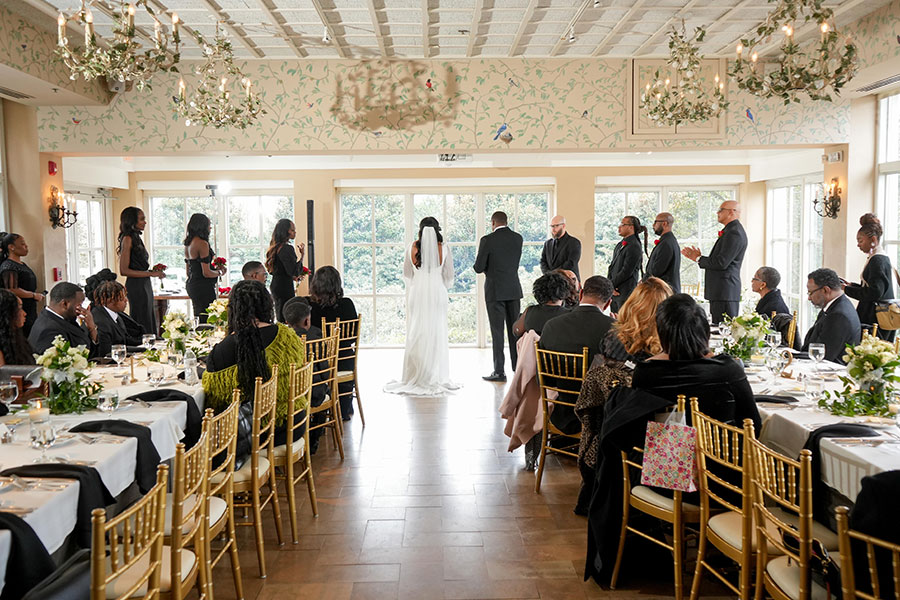 Latisha and Ronald | Still Shots Photography Latisha and Ronald stand before the pastor and their families and exchange vows in the Pavilion Room.