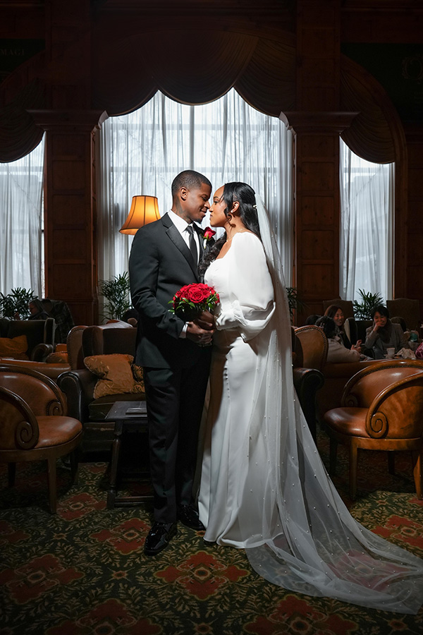 Latisha and Ronald | Still Shots Photography Latisha and Ronald share a loving embrace in O.Henry Hotel's social lobby.