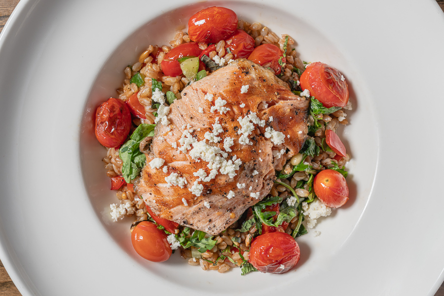 Warm Farro Salmon Salad Warm Farro Salmon Salad, cherry tomatoes, cucumber, red bell pepper mint, pine nuts, garden rocket, feta, garlic-oregano vinaigrette