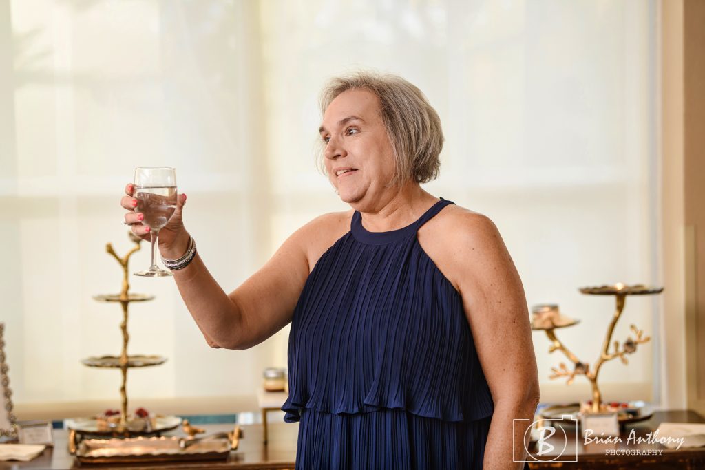 The wedding director, Wyna Howe, is also Kim's best friend. Photo by Brian Anthony Photography. Photo of the bride's best friend sharing a congratulatory toast.
