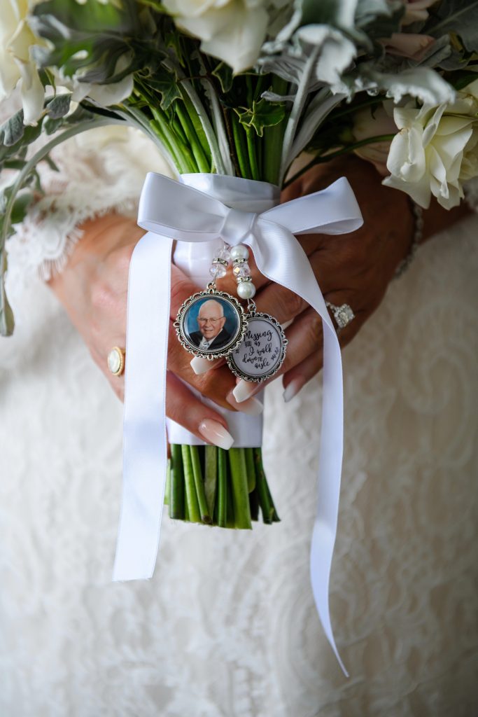 Kim's bouquet honors her late father with a charm and quote, "Missing you as I walk down the aisle.” Photo by Brian Anthony Photography.