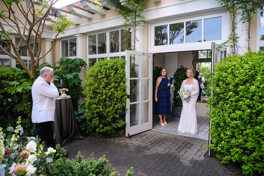 Bride and Groom see each other as the ceremony begins Walking through the double doors and into the Cloister Garden, Kim took Jim's breath away.