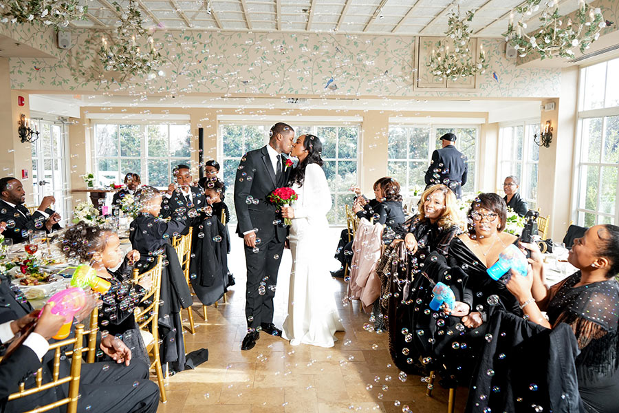 Latisha and Ronald | Still Shots Photography Ronald and Latisha are now husband and wife! The guests erupted in cheers and showered the couple with bubbles after they said "I do!"